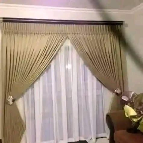 Gold pleated curtains with pelmet, installed by Chiwondo Home Choice