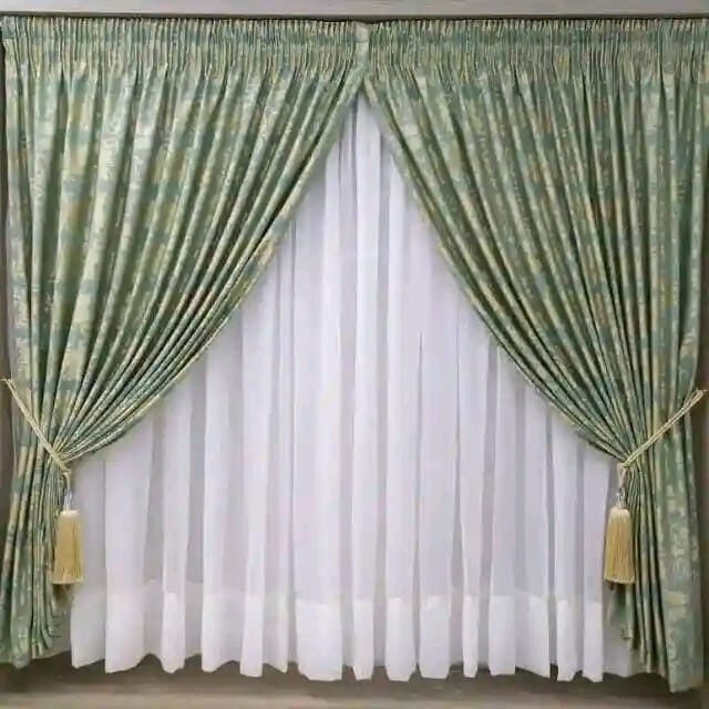 Sage green curtains with tasselled tie-backs from Chiwondo Home Choice